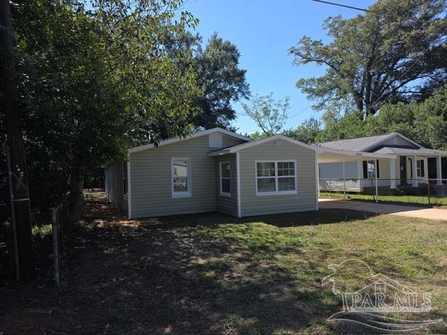 4001 Harrison Avenue Jay, FL 32565 - Photo 1 of 20 a front view of house with yard and trees