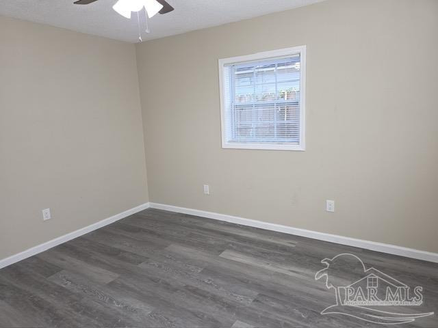 4001 Harrison Avenue Jay, FL 32565 - Photo 11 of 20 a view of room with window and hardwood floor