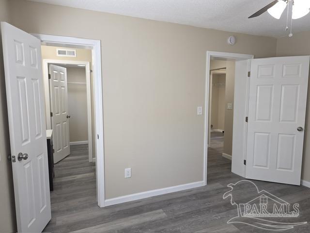 4001 Harrison Avenue Jay, FL 32565 - Photo 12 of 20 an empty room with wooden floor and closet