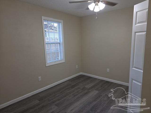 4001 Harrison Avenue Jay, FL 32565 - Photo 13 of 20 a room with a wooden floor and a window