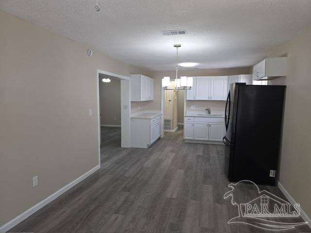 4001 Harrison Avenue Jay, FL 32565 - Photo 15 of 20 a kitchen with refrigerator and cabinets