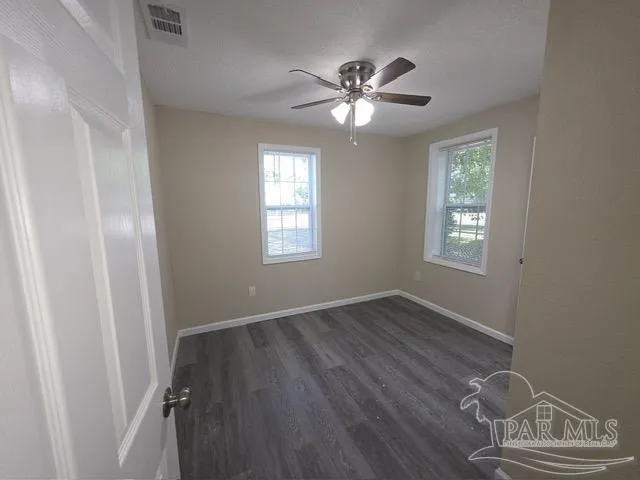 wooden floor and window in a room