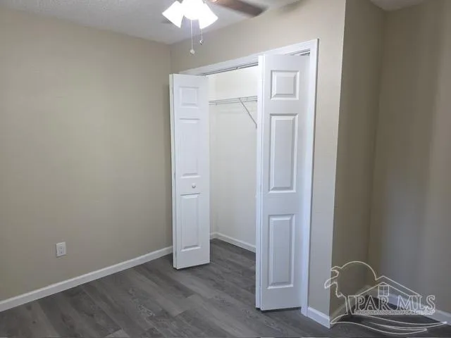 a view of a wooden house with a yard