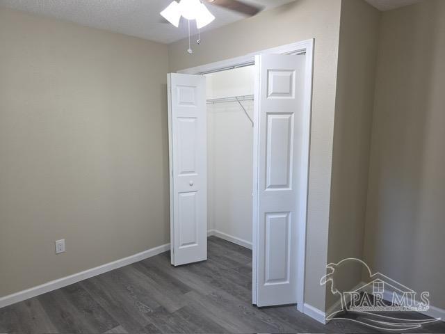 4001 Harrison Avenue Jay, FL 32565 - Photo 19 of 20 an empty room with wooden floor and closet