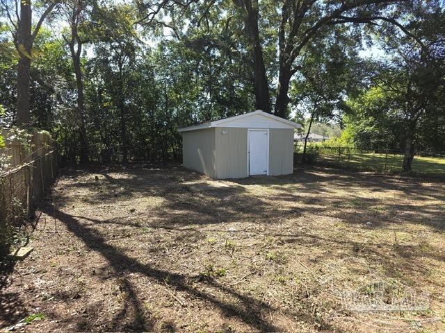 4001 Harrison Avenue Jay, FL 32565 - Photo 20 of 20 a view of a wooden house with a yard