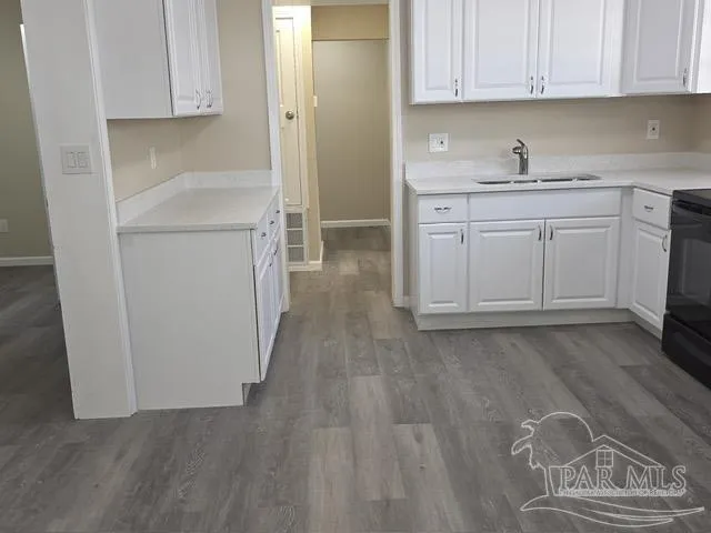 a kitchen with a sink and cabinets