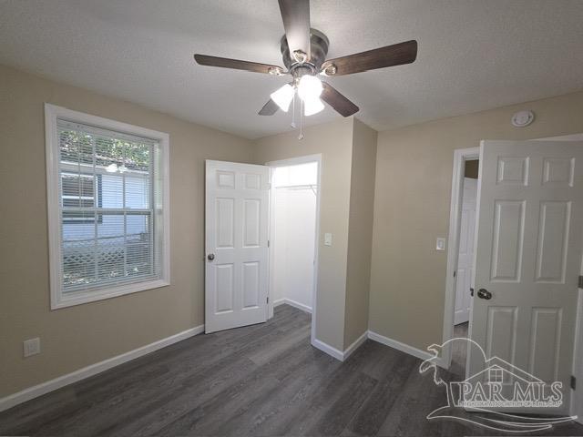 4001 Harrison Avenue Jay, FL 32565 - Photo 6 of 20 wooden floor in an empty room with a window