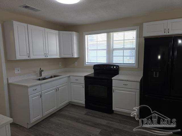 4001 Harrison Avenue Jay, FL 32565 - Photo 7 of 20 a kitchen with a sink appliances and cabinets