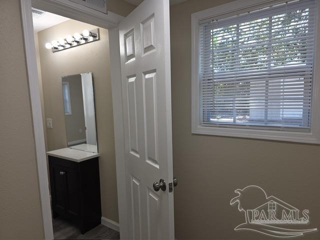 4001 Harrison Avenue Jay, FL 32565 - Photo 8 of 20 a view of a hallway with windows