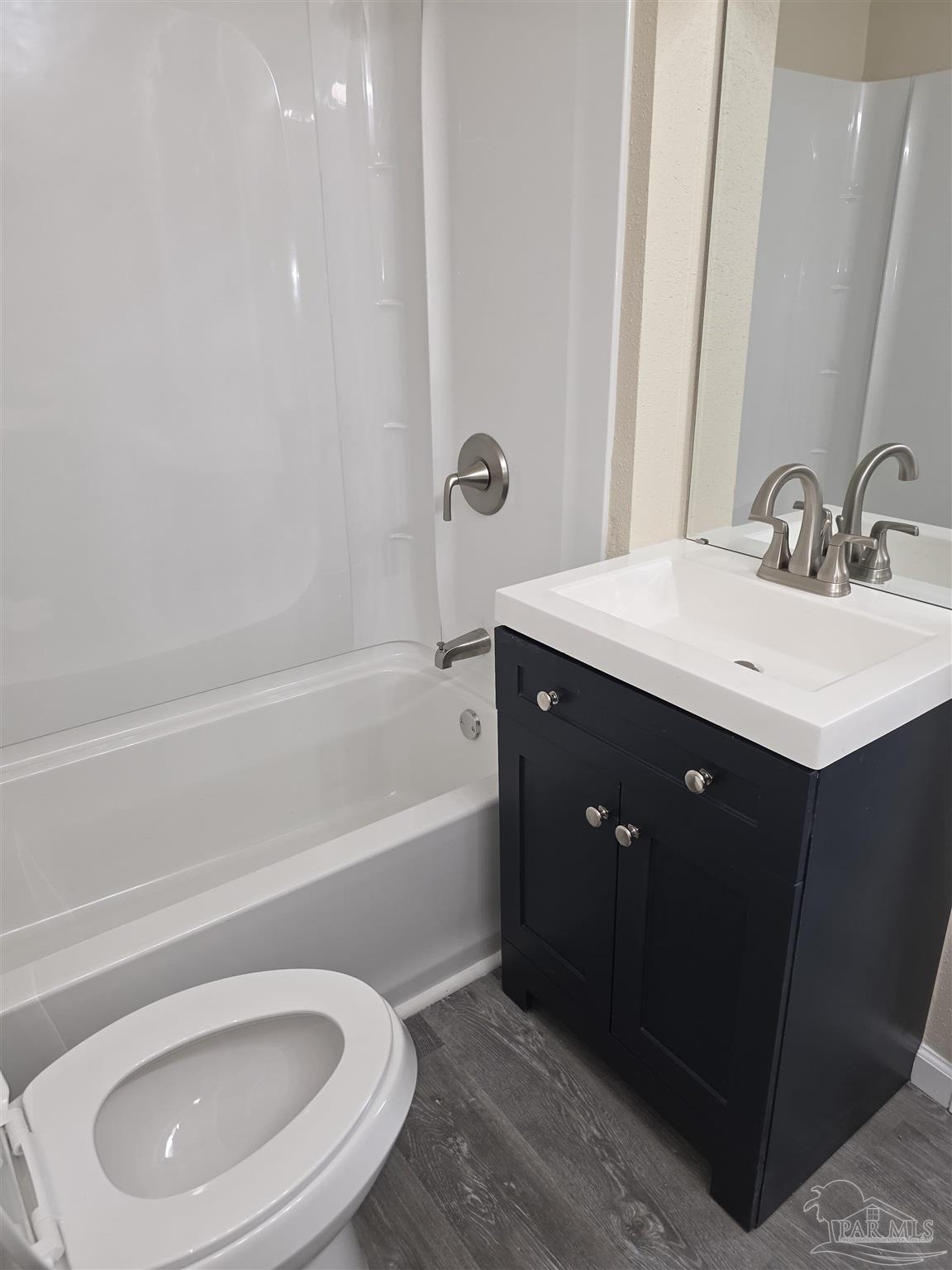 4001 Harrison Avenue Jay, FL 32565 - Photo 9 of 20 a bathroom with a sink a toilet and bathtub