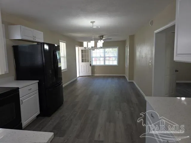 a view of room with window and hardwood floor