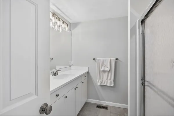 an empty room with windows and entrance