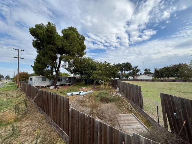 a balcony with wooden floor