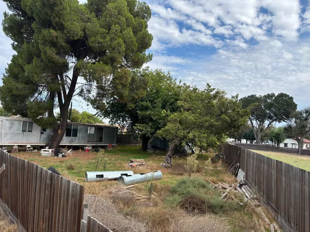 a view of a house with swimming pool and sitting area