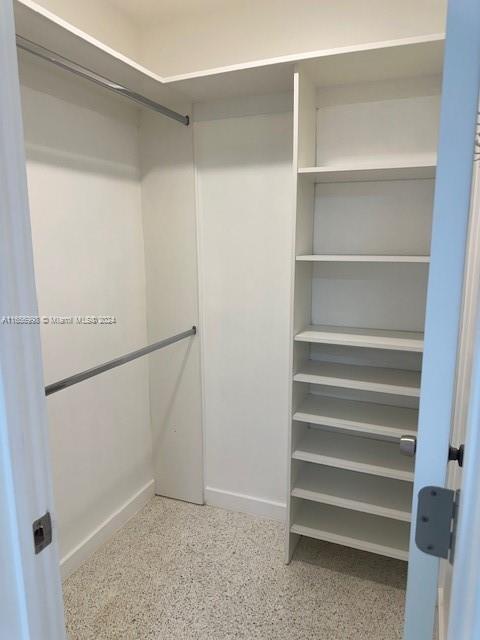 3677 Southwest 14th Street Miami, FL 33145 - Photo 11 of 12 a view of walk in closet with empty racks