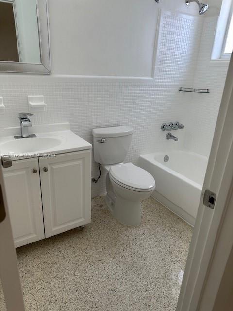 3677 Southwest 14th Street Miami, FL 33145 - Photo 7 of 12 a bathroom with a sink a toilet and bathtub