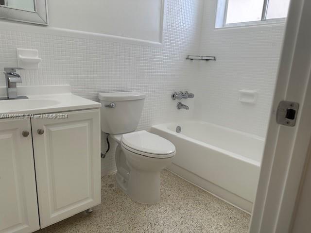 3677 Southwest 14th Street Miami, FL 33145 - Photo 8 of 12 a bathroom with a toilet sink and shower
