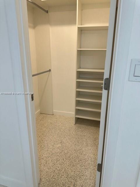 3677 Southwest 14th Street Miami, FL 33145 - Photo 10 of 12 a view of closet area with empty racks