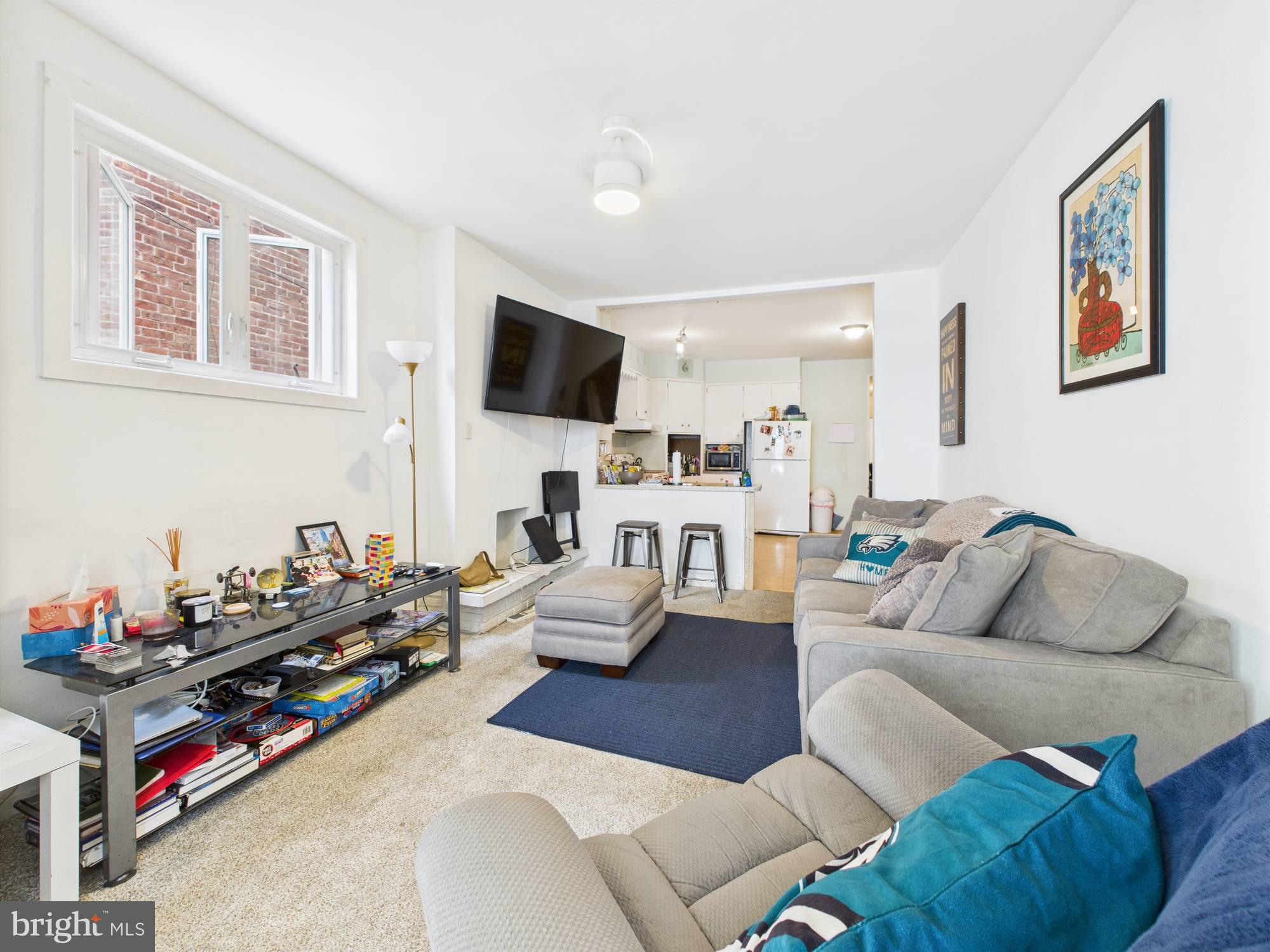 4073 West Ford Road Philadelphia, PA 19131 - Photo 12 of 50 a living room with furniture or couch and a flat screen tv