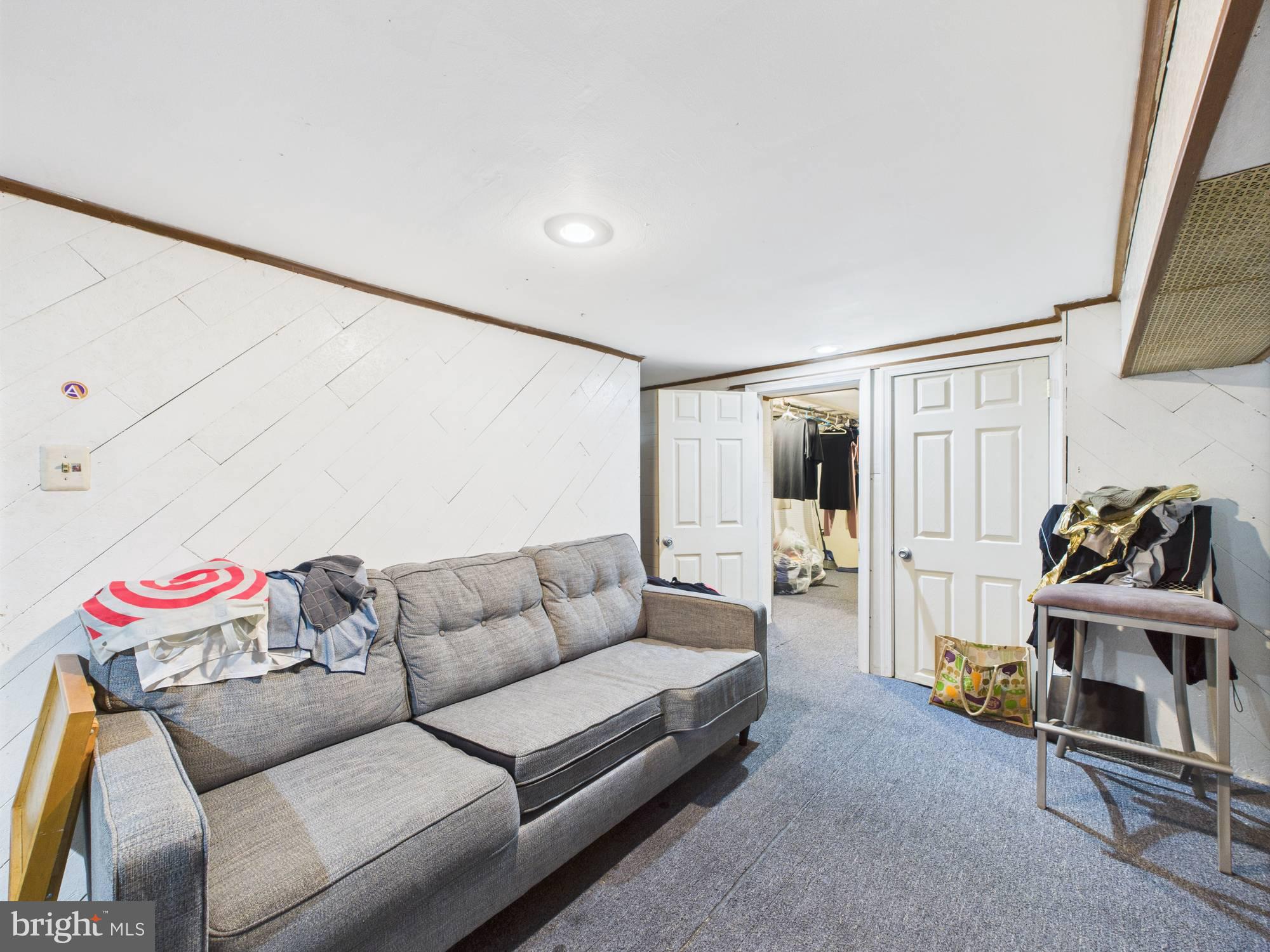 4073 West Ford Road Philadelphia, PA 19131 - Photo 29 of 50 a living room with furniture and a couch