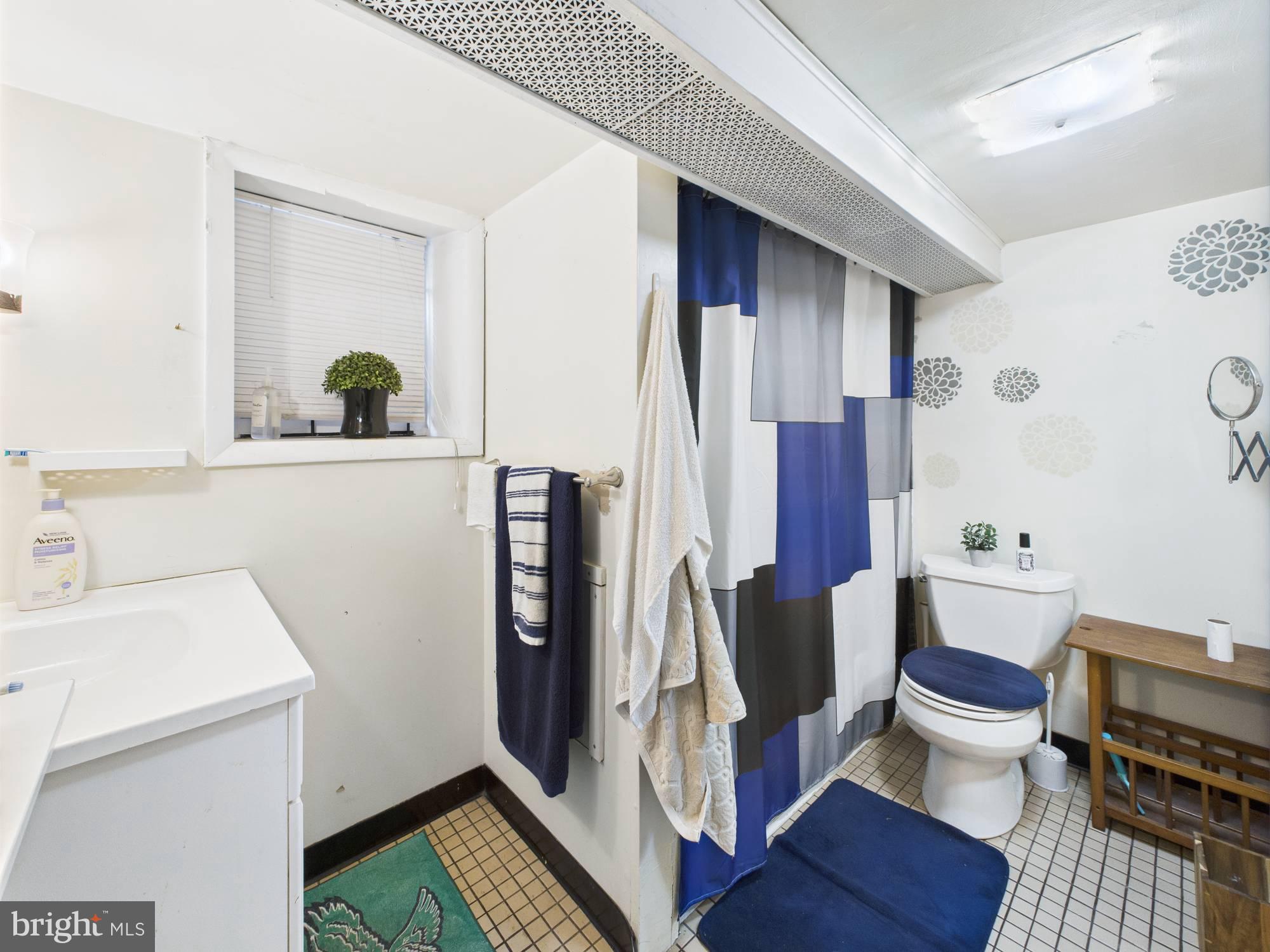 4073 West Ford Road Philadelphia, PA 19131 - Photo 31 of 50 a bathroom with a sink and toilet