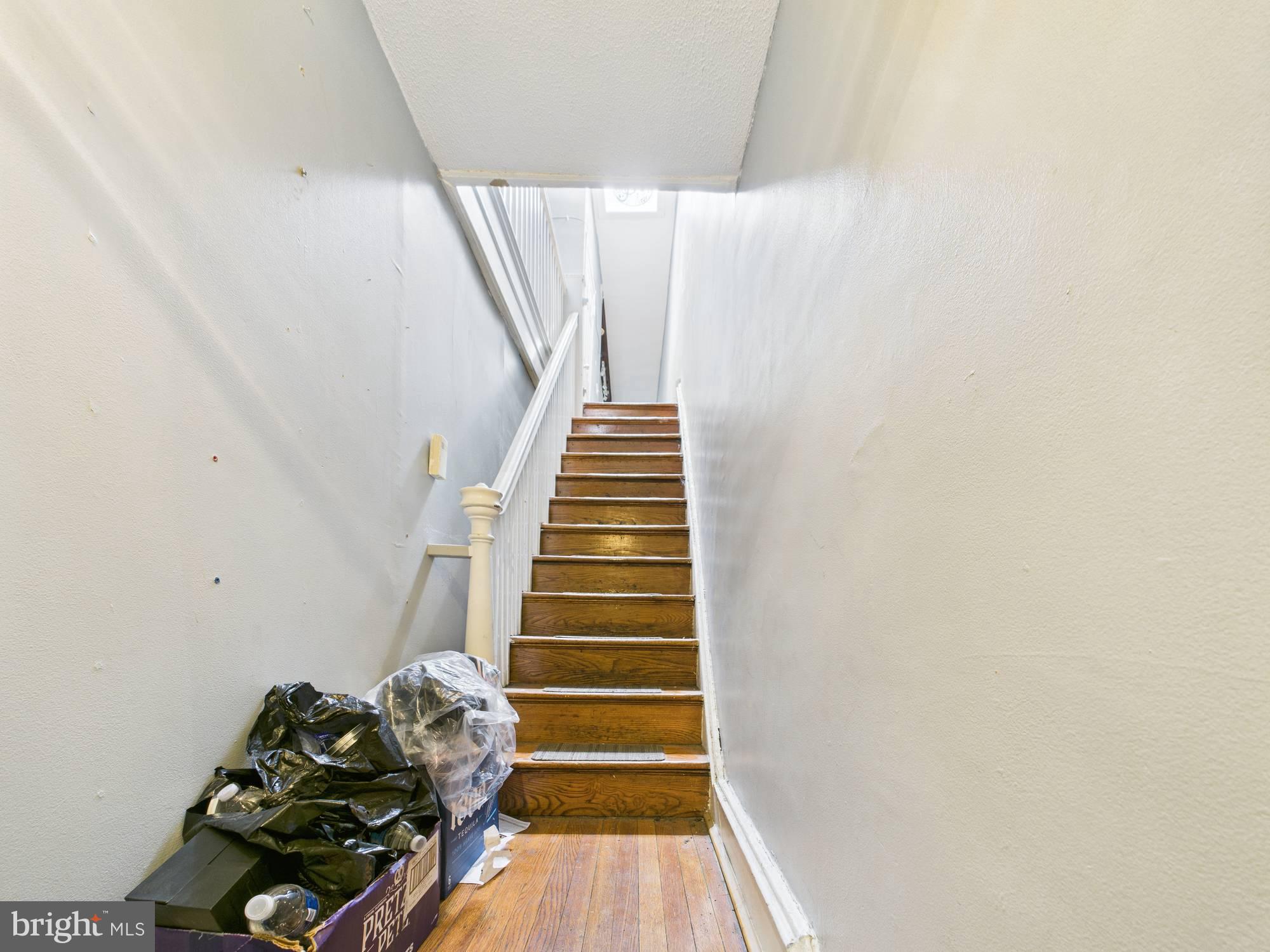 4073 West Ford Road Philadelphia, PA 19131 - Photo 34 of 50 a view of entryway with stairs and wooden floor