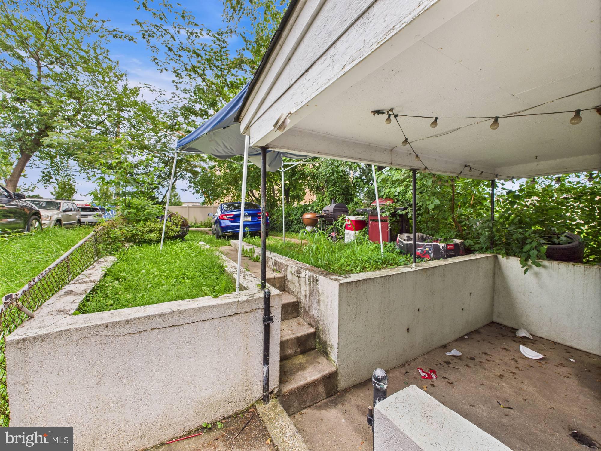 4073 West Ford Road Philadelphia, PA 19131 - Photo 4 of 50 a view of a patio with a table and chairs