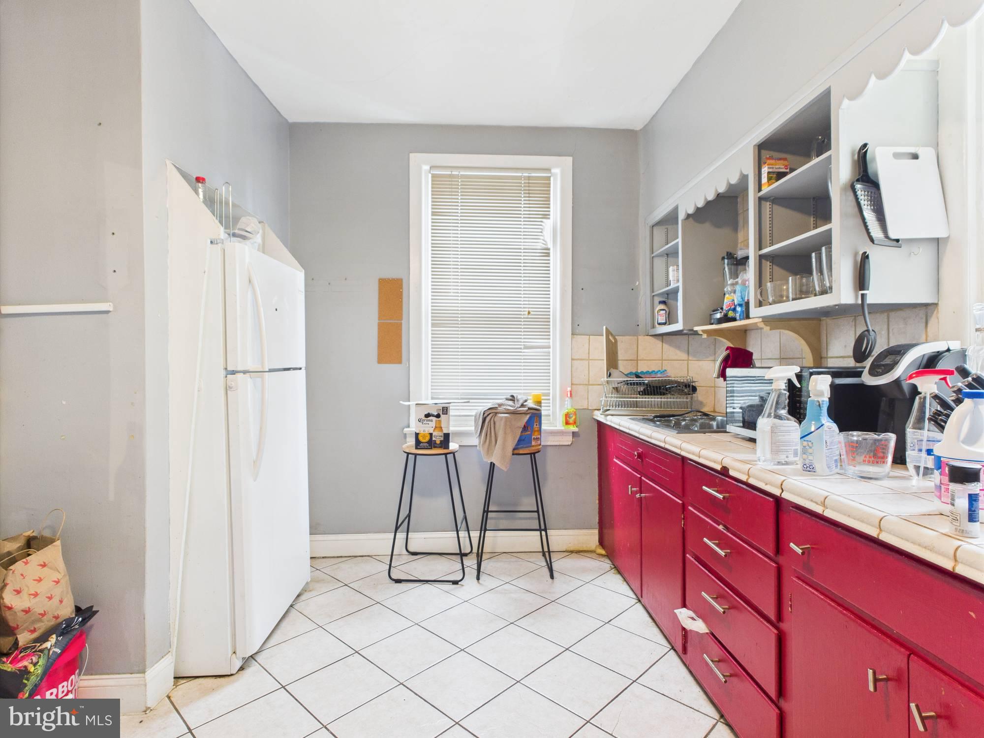4073 West Ford Road Philadelphia, PA 19131 - Photo 42 of 50 a kitchen with stainless steel appliances granite countertop a refrigerator and a sink