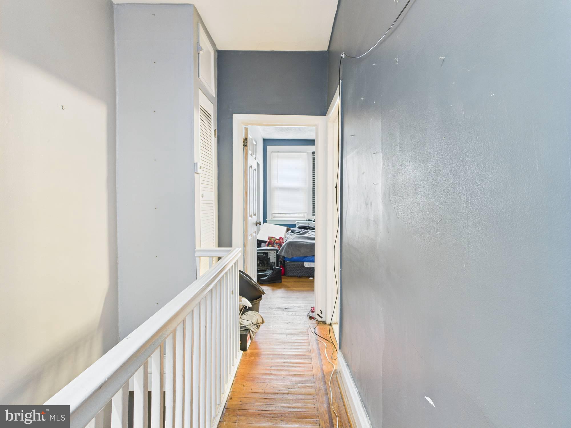 4073 West Ford Road Philadelphia, PA 19131 - Photo 44 of 50 a view of a hallway with a livingroom and a bathroom with sink