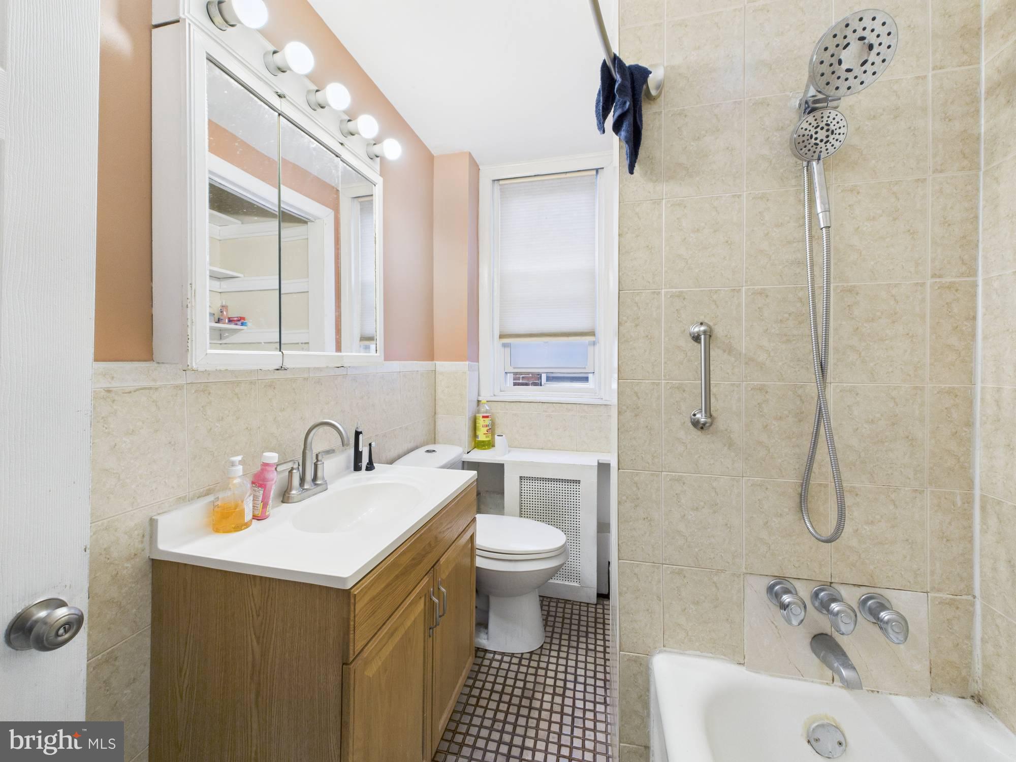 4073 West Ford Road Philadelphia, PA 19131 - Photo 45 of 50 a bathroom with a sink a toilet and shower