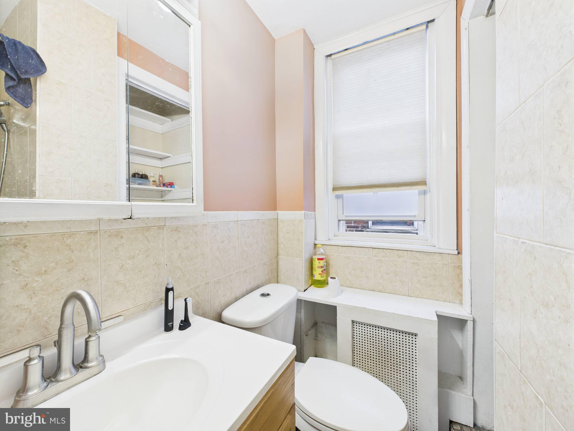 4073 West Ford Road Philadelphia, PA 19131 - Photo 47 of 50 a bathroom with a sink and a toilet