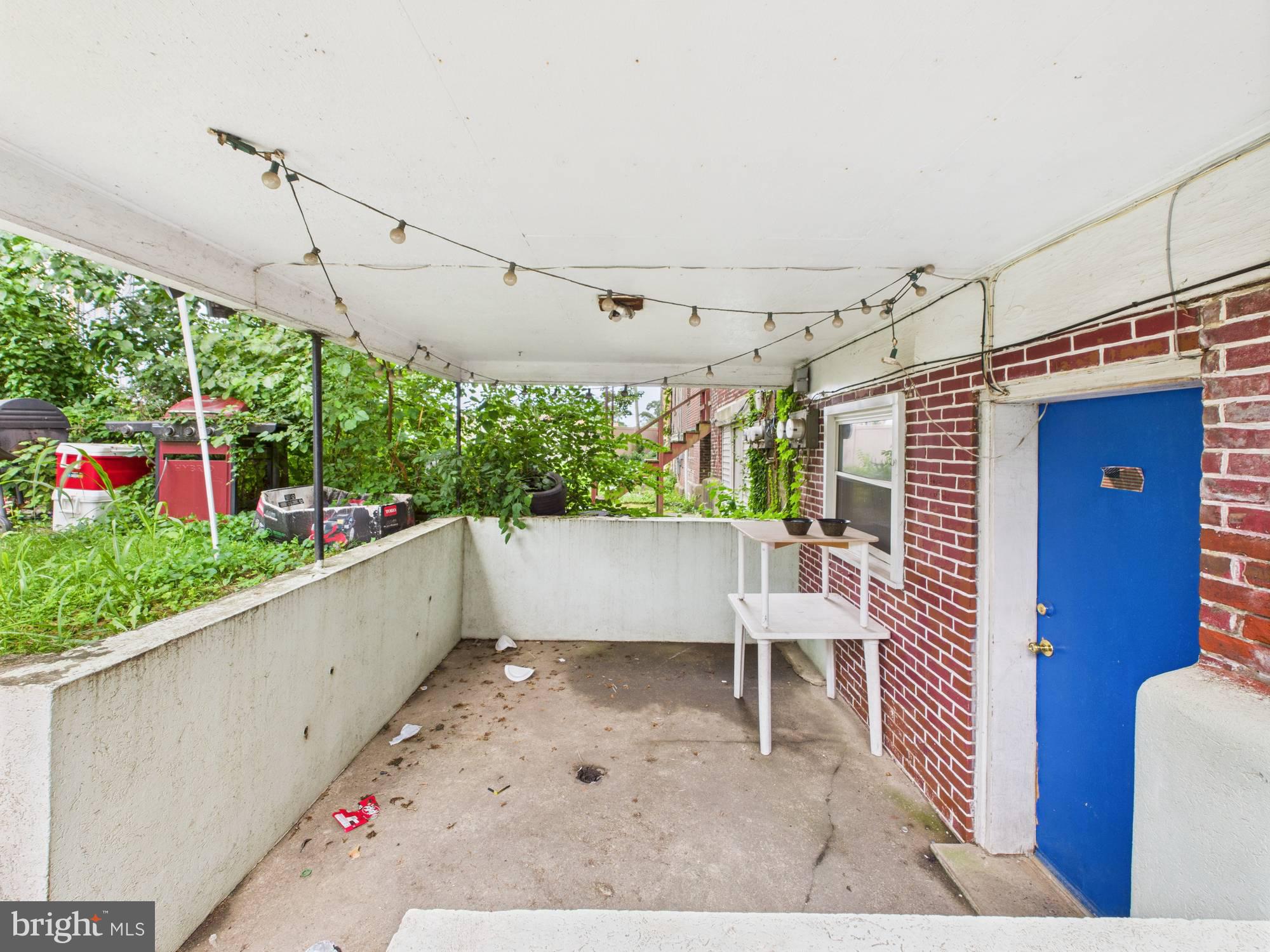 4073 West Ford Road Philadelphia, PA 19131 - Photo 5 of 50 a view of a porch with furniture and a garden