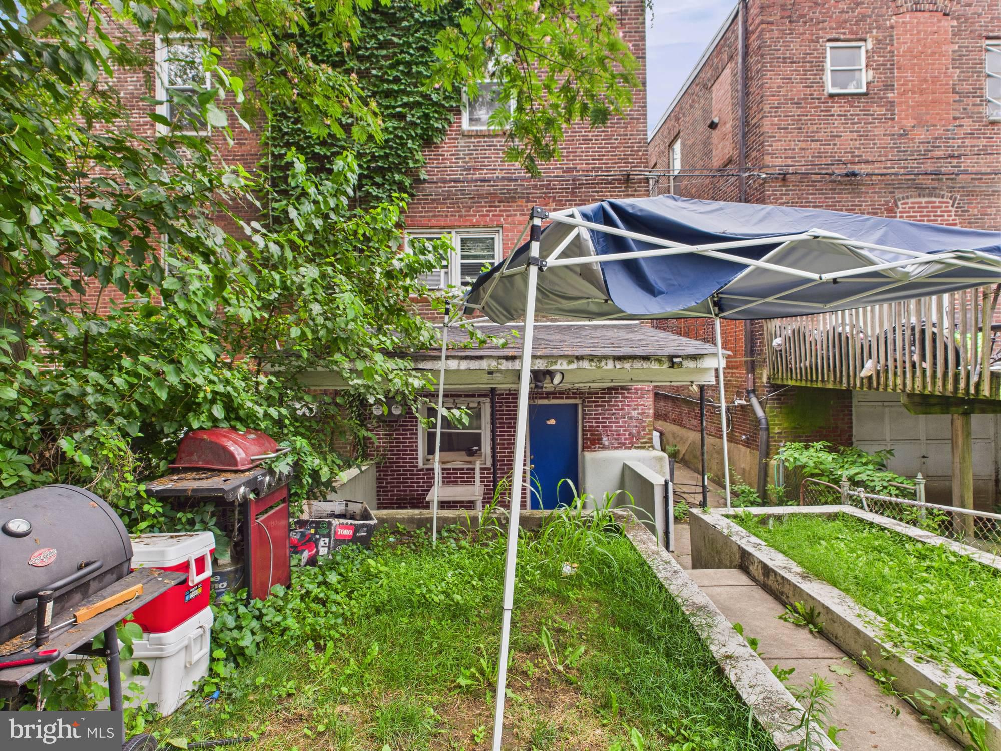 4073 West Ford Road Philadelphia, PA 19131 - Photo 6 of 50 a view of a chair and table in backyard of the house