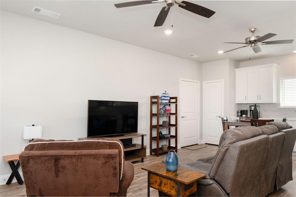 849 County Road 4764 Boyd, TX 76023 - Photo 31 of 40 a living room with furniture and a flat screen tv