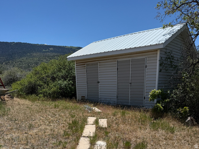10000 North 6730th East Spring City, UT 84662 - Photo 26 of 31 Utility shed with light-colored siding and a metal roof