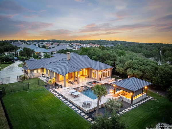 an aerial view of residential houses and outdoor space