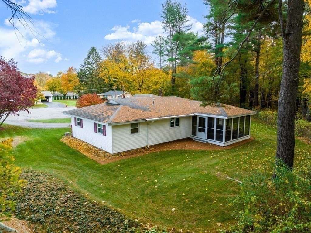 7 Howard Road Hudson, MA 01749 - Photo 32 of 40 a aerial view of a house with a yard table and chairs