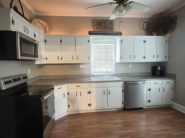 a bed room with a bed and a chandelier