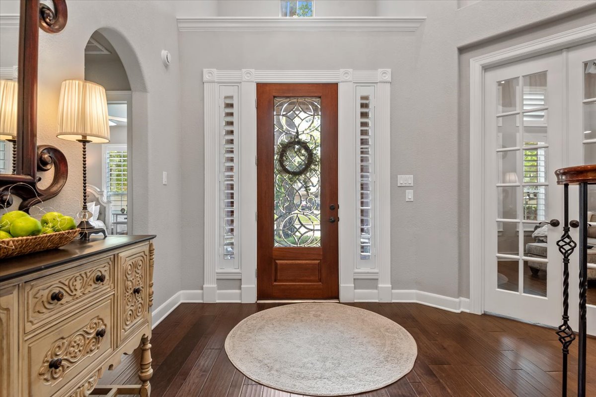 15519 Stallion Point Circle Cypress, TX 77429 - Photo 5 of 37 Foyer featuring hardwood floors, a decorative front door with side lites, and a white framed double door entry