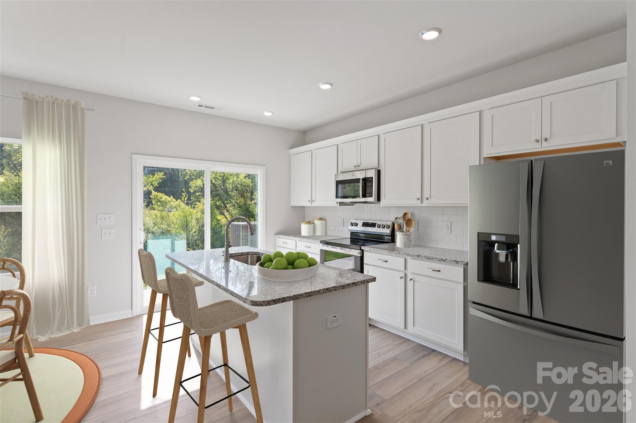 3017 Kingsfield Road, Unit 49 Charlotte, NC 28208 - Photo 5 of 10 a kitchen with stainless steel appliances granite countertop sink refrigerator and cabinets