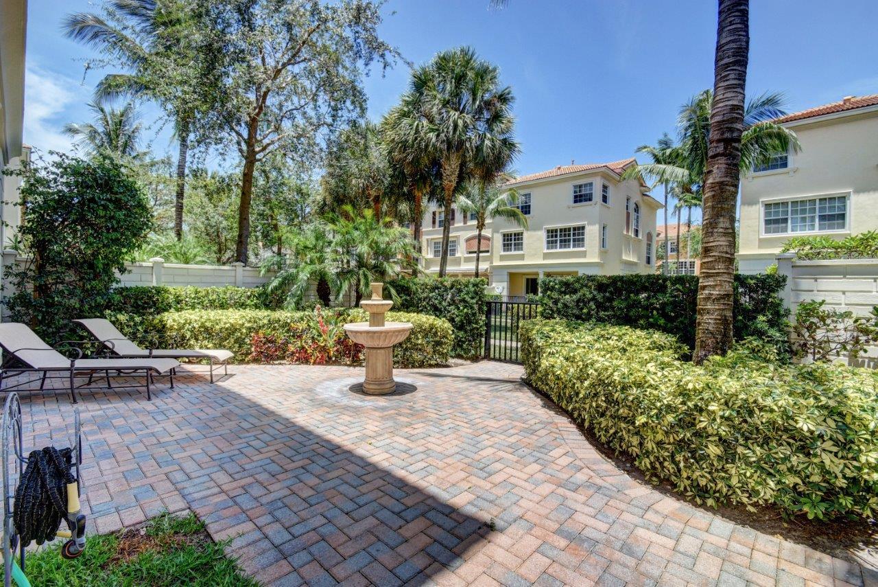 5610 Northeast Trieste Terrace Boca Raton, FL 33487 - Photo 11 of 44 a view of a house with sitting area and garden