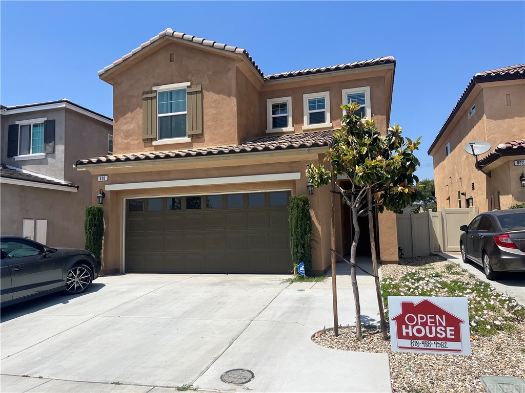 a front view of a house with a garage