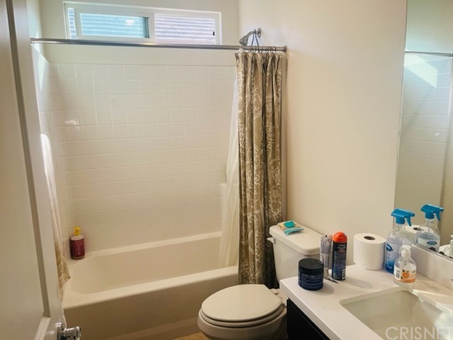 610 West Woodcrest Street Rialto, CA 92376 - Photo 20 of 33 a bathroom with a sink toilet and shower