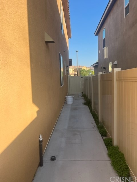 610 West Woodcrest Street Rialto, CA 92376 - Photo 25 of 33 a view of a pathway both side of building