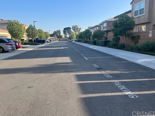 610 West Woodcrest Street Rialto, CA 92376 - Photo 28 of 33 a view of a street with a cars parked on the side of road