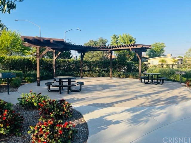 610 West Woodcrest Street Rialto, CA 92376 - Photo 30 of 33 a view of a patio with a table and chairs and potted plants