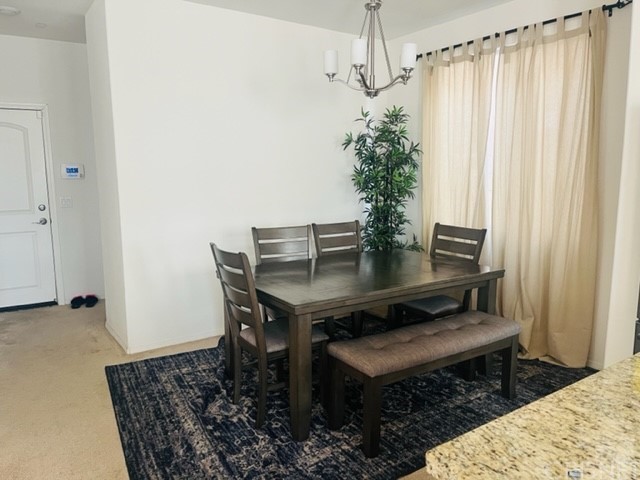 610 West Woodcrest Street Rialto, CA 92376 - Photo 8 of 33 a view of a room with a table and chairs