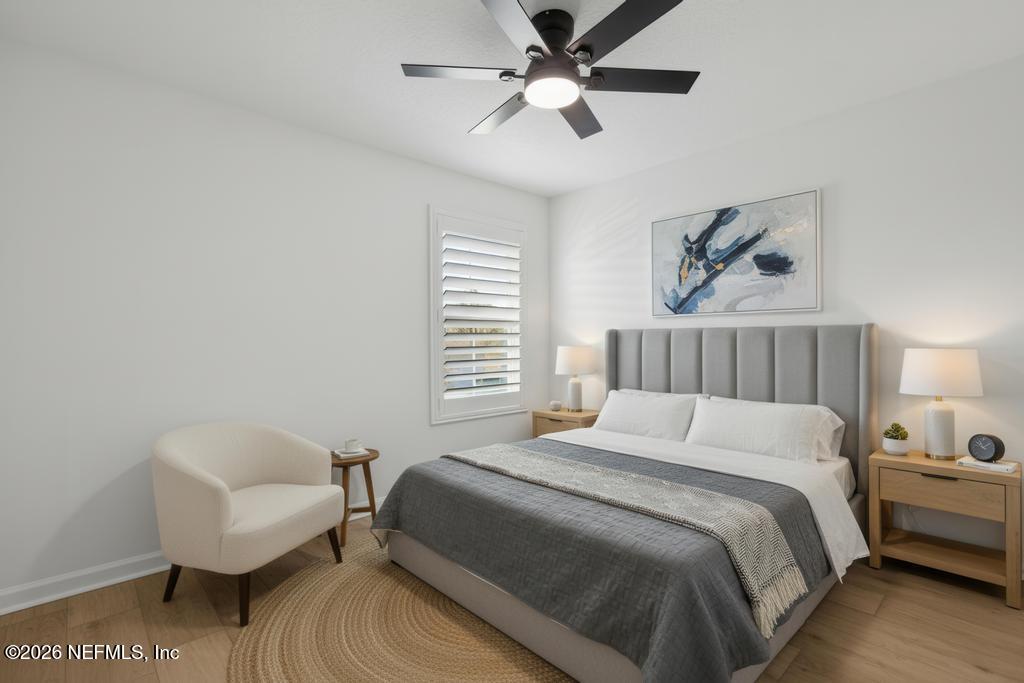 45 Seaport Breeze Road St. Augustine, FL 32095 - Photo 51 of 88 a bedroom with a bed and a chair