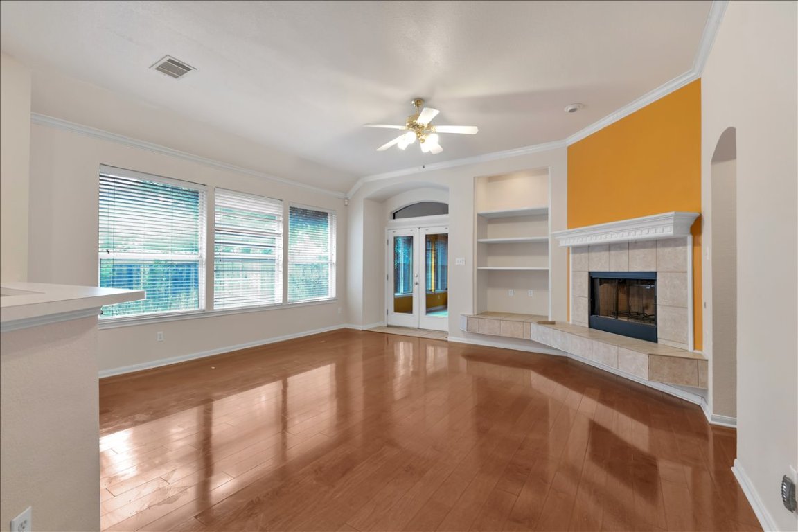 9237 La Siesta Bend Austin, TX 78749 - Photo 12 of 29 a view of an empty room with a fireplace and a window