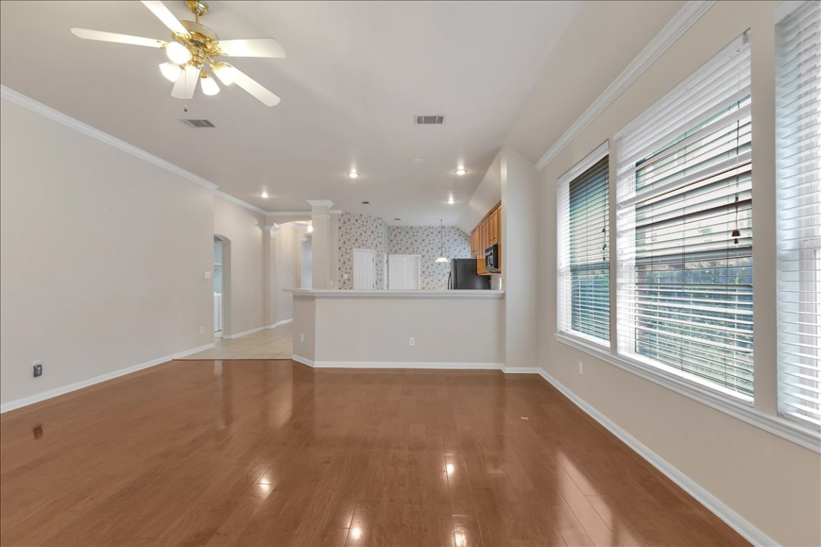 9237 La Siesta Bend Austin, TX 78749 - Photo 15 of 29 a view of a livingroom with a ceiling fan and window